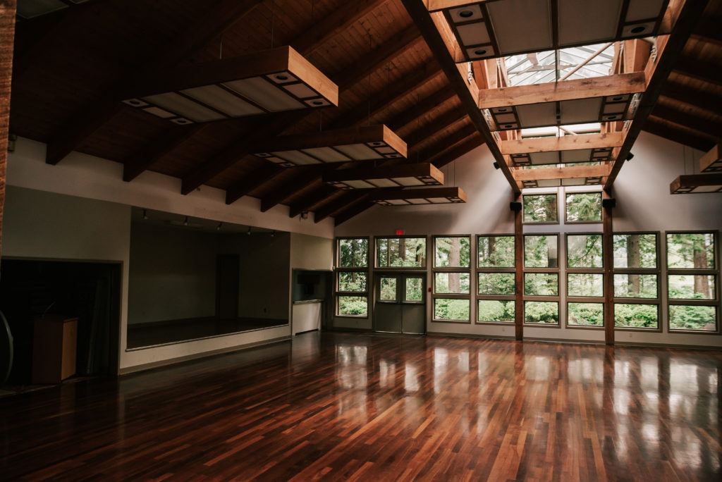 Exposed beams and skylights letting natural light into the banquet hall